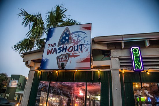 Enjoy food and drinks at The Washout Folly beach with scenic views of the water.
